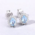 0.80 Ct Oval Blue Aquamarine & Lab Diamond Prong Silver Halo Basket Stud Earrings by Fine Color Jewels
