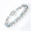 11 Ct Heart Blue Topaz Prong Silver Tennis Bracelet by Fine Color Jewels