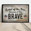 Land Of The Free Because Of The Brave Sign by Tailored Canvases