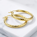 14k Yellow Gold Diamond Cut Hoop Earrings (20mm) by Avera Group