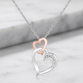 Sterling Silver Cascading Dual Heart Diamond Accented Pendant (.02 cttw) by Avera Group