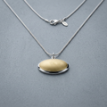 Avera Oval Eye Pendant Necklace in Beige by Avera Group