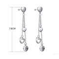 Long Dangling Heart Earrings in White Gold by DailySale