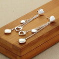 Long Dangling Heart Earrings in White Gold by DailySale