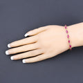 Marquise Pink Ruby Prong 10K Yellow Gold Tennis Bracelet by Fine Color Jewels