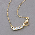 0.24 Ct Round Blue Aquamarine Prong 18K Gold Plated Silver Heart & Infinity Necklace by Fine Color Jewels
