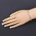 Oval Blue Aquamarine Prong Two-Tone Gold Plated Silver Infinity Bolo Adjustable Bracelet by Fine Color Jewels