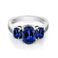 Oval Cut Tri Stone Blue Topaz Ring - Assorted Sizes by DailySale