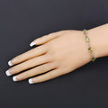Oval Green Peridot Prong Two-Tone Gold Plated Silver Infinity Bolo Adjustable Bracelet by Fine Color Jewels