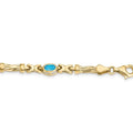 Oval Swiss Blue Topaz Bezel 10K Yellow Gold Fancy Link Bracelet by Fine Color Jewels