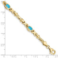 Oval Swiss Blue Topaz Bezel 10K Yellow Gold Fancy Link Bracelet by Fine Color Jewels