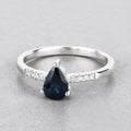 0.86ct Pear Blue Sapphire and Diamond Prong Bridge 14K White Gold Teardrop Pave Band Ring by Fine Color Jewels
