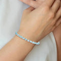 Round Swiss Blue Topaz Prong Sterling Silver Tennis Bracelet by Fine Color Jewels