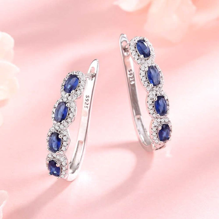 Sapphire Halo Simulated Huggie Earrings in Sterling Silver by DailySale