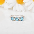 Three Stone Blue Topaz Ring by Fine Color Jewels