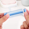 Toothpaste Squeezer Rolling Dispenser by DailySale