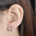 Tri Heart Petite Huggie Earrings by DailySale